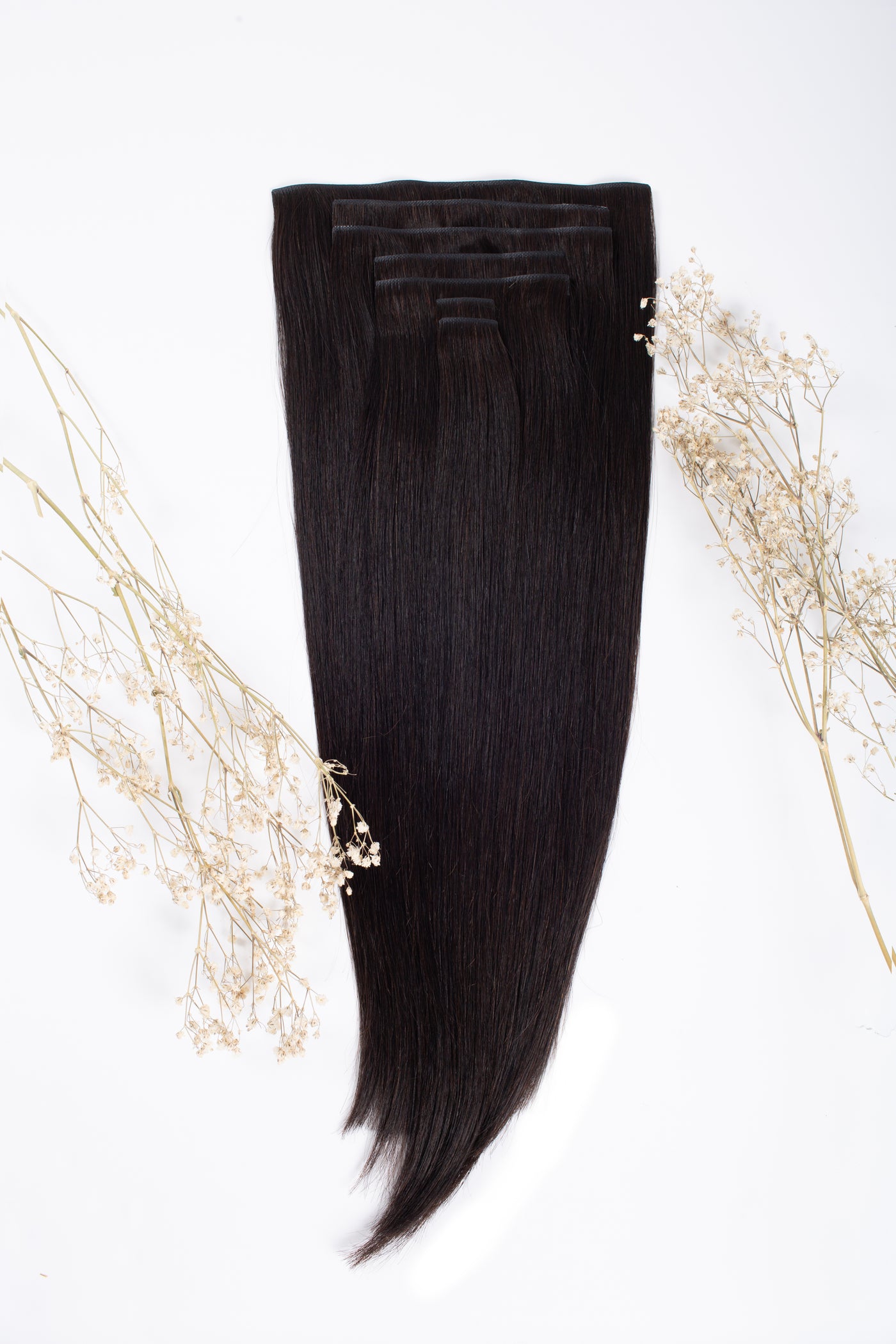 Off-black clip-in hair extensions, long straight weft with smooth top