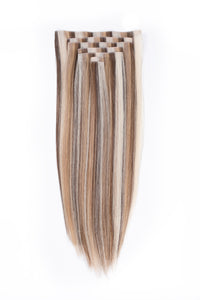 Clip-in hair extensions with a checkered clip backing; straight vanilla-blend strands