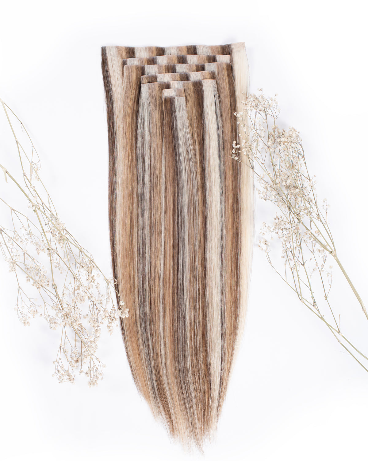 Clip-in hair extensions: long straight vanilla-blend strands with clip attachment