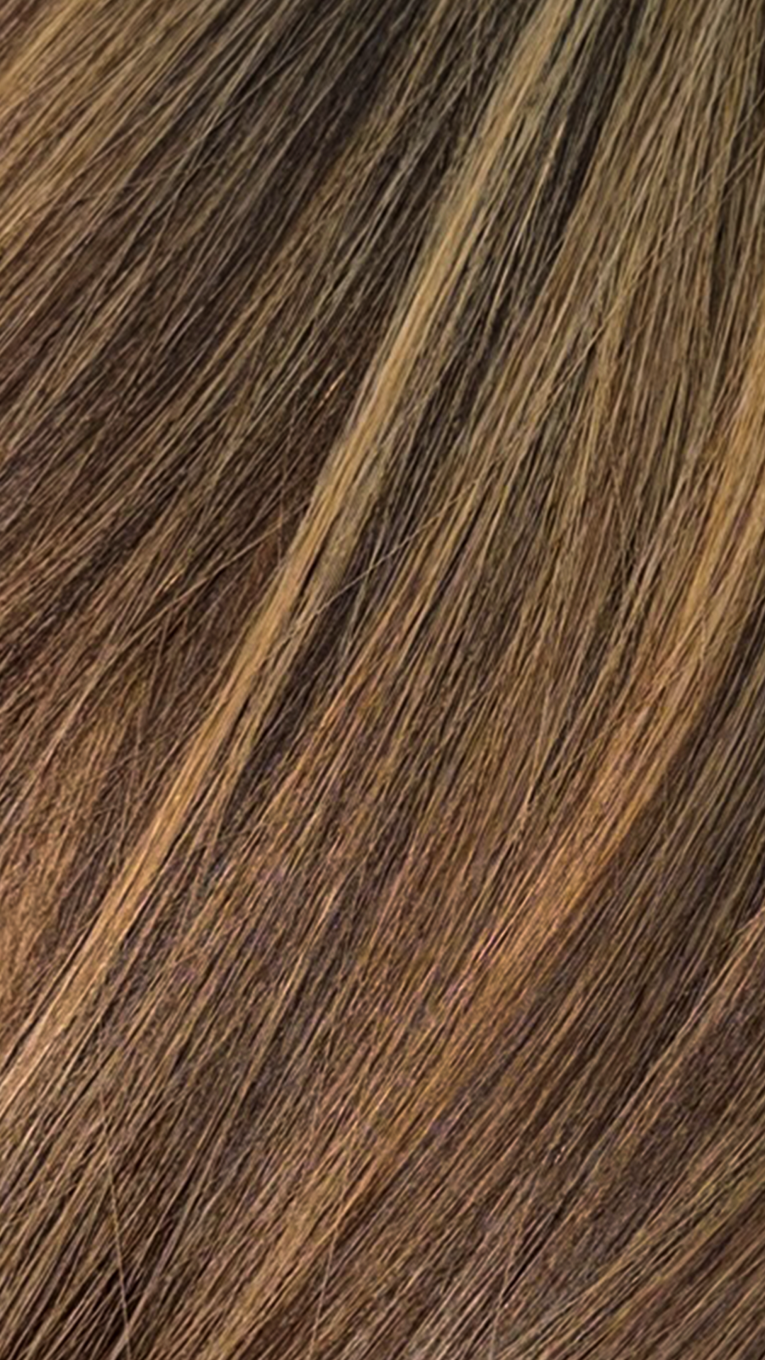 Hair extension bundle with dark brown strands and blended blonde highlights