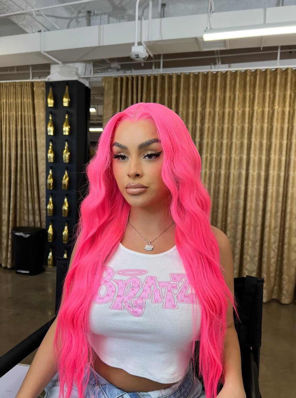 Pink long lace wig with wavy hair, center part, long loose strands