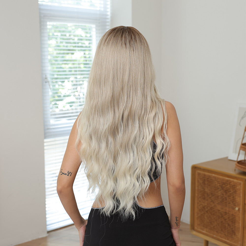 Long blonde wig with dark roots, full back view of wavy curls