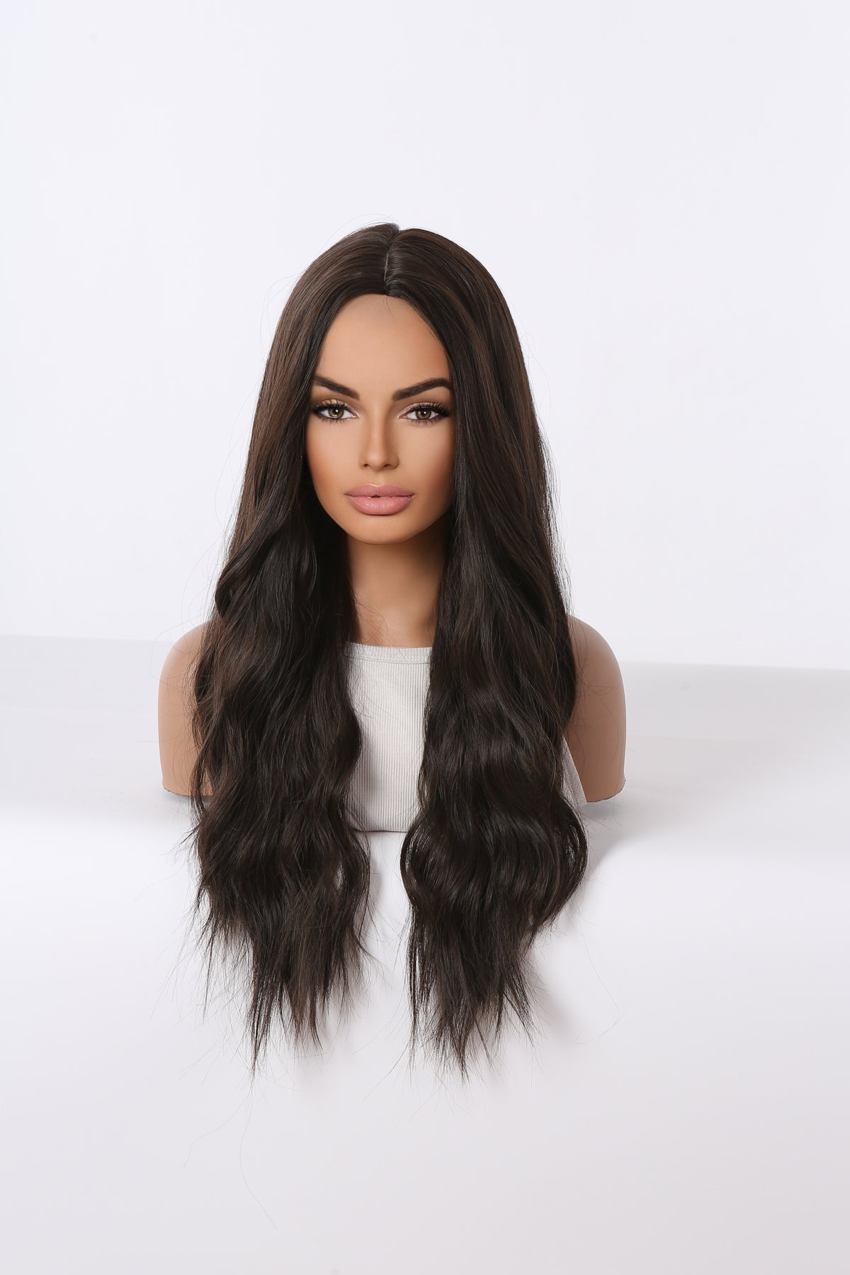 Long brunette wavy wig with natural-looking hairline, front view
