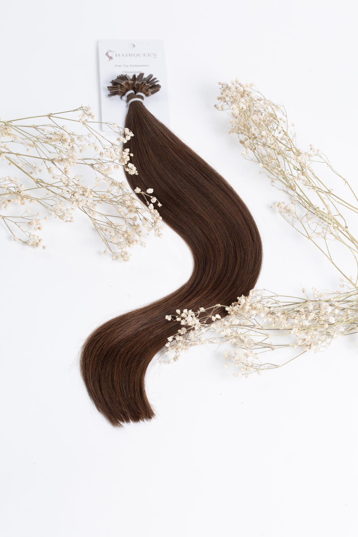 Chocolate brown hair extension bundle with clips, with small decorative flowers