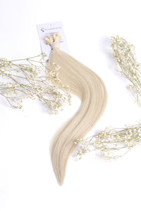 Platinum blonde K-tips hair extensions, long wavy bonded strands