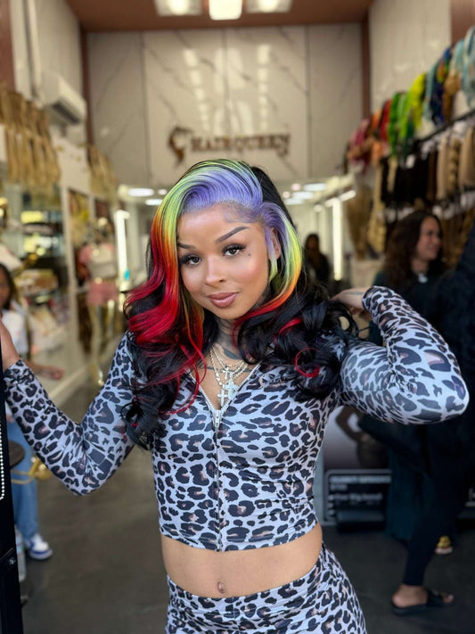 Rainbow lace wig with center-parted wavy hair, black base with red, blue, and green highlights