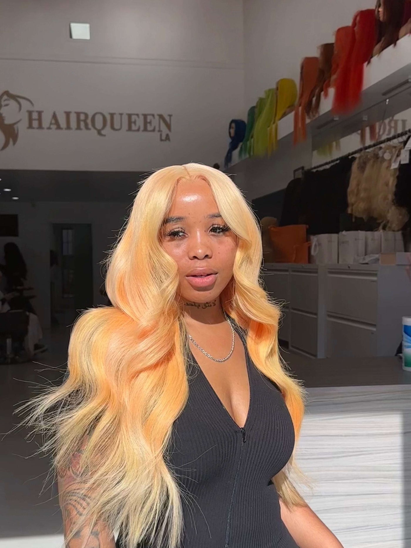 Long blonde wavy wig with voluminous curls and center part