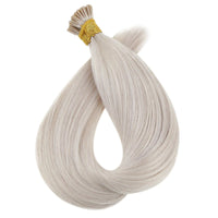 Hair extension bundle with light gray-beige strands and gold bead at the top