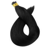 I-Tip hair extension bundle with black strands and gold bead at the top