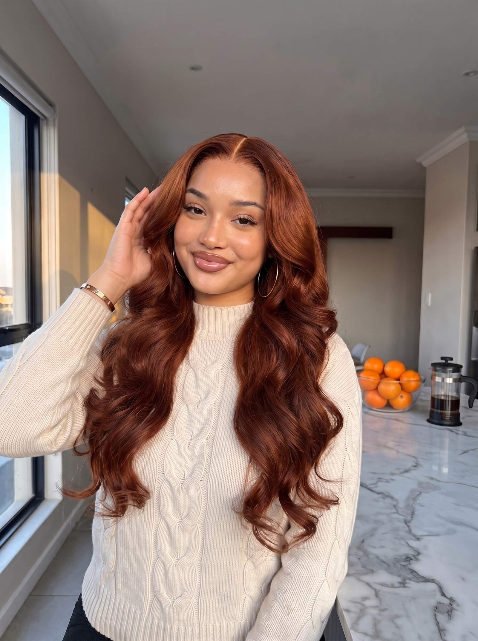 Auburn long wavy lace wig on model, center part, styled loose curls