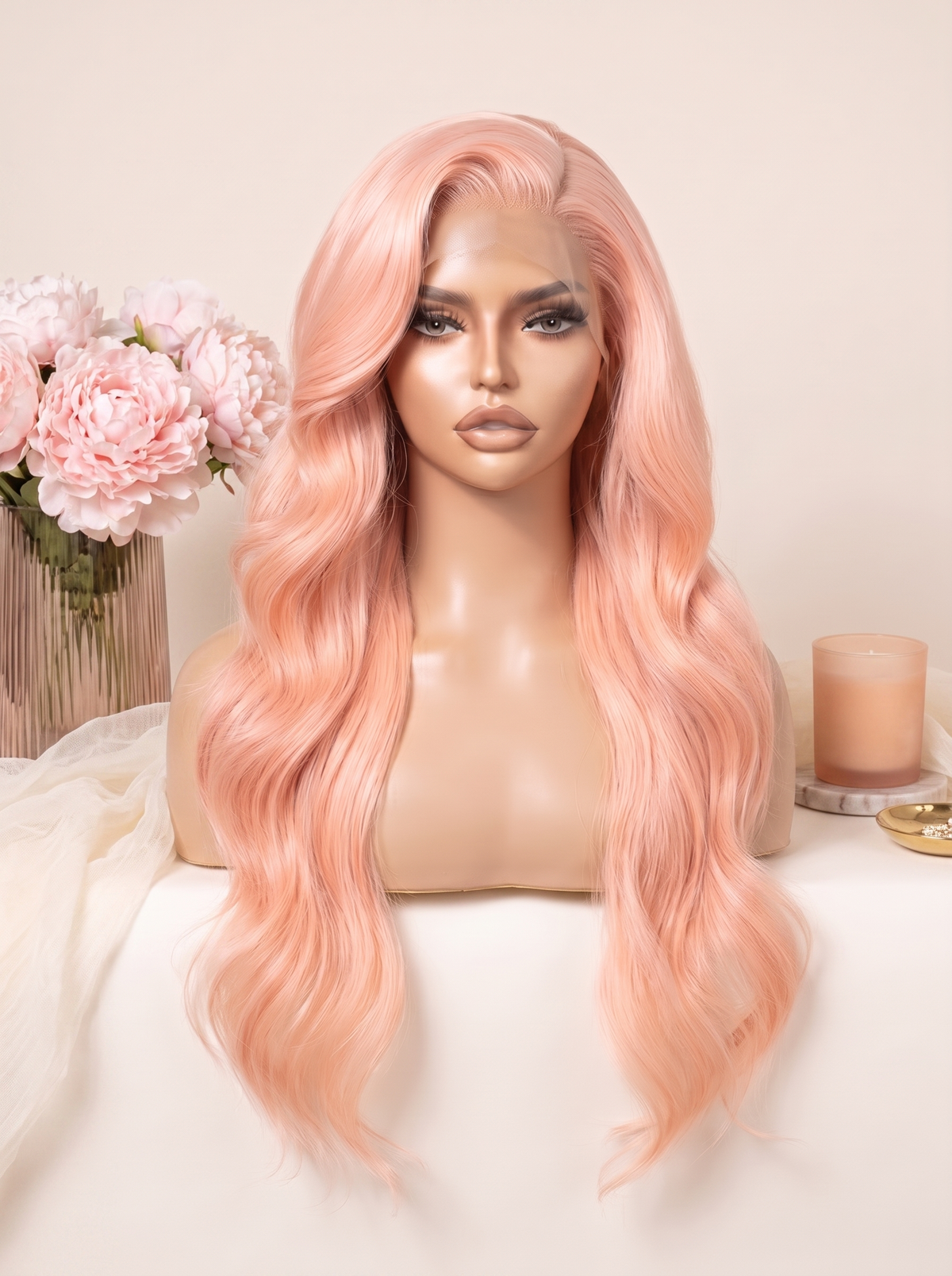 Light pink long wavy lace wig on a mannequin head, soft center part.