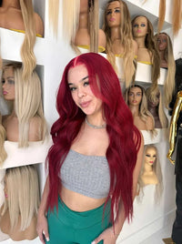 Long deep red wavy wig with center part and full volume