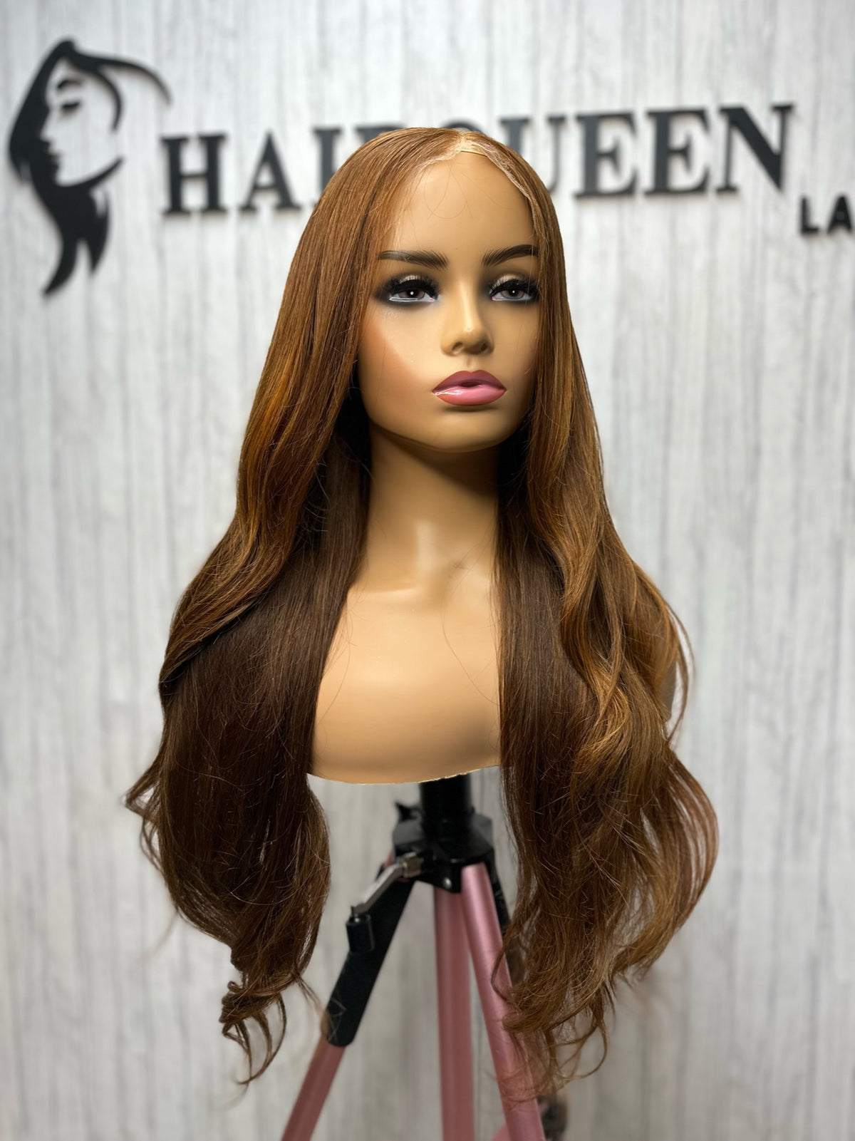 Lace wig with long wavy golden-brown hair and lace front, falling evenly around the face