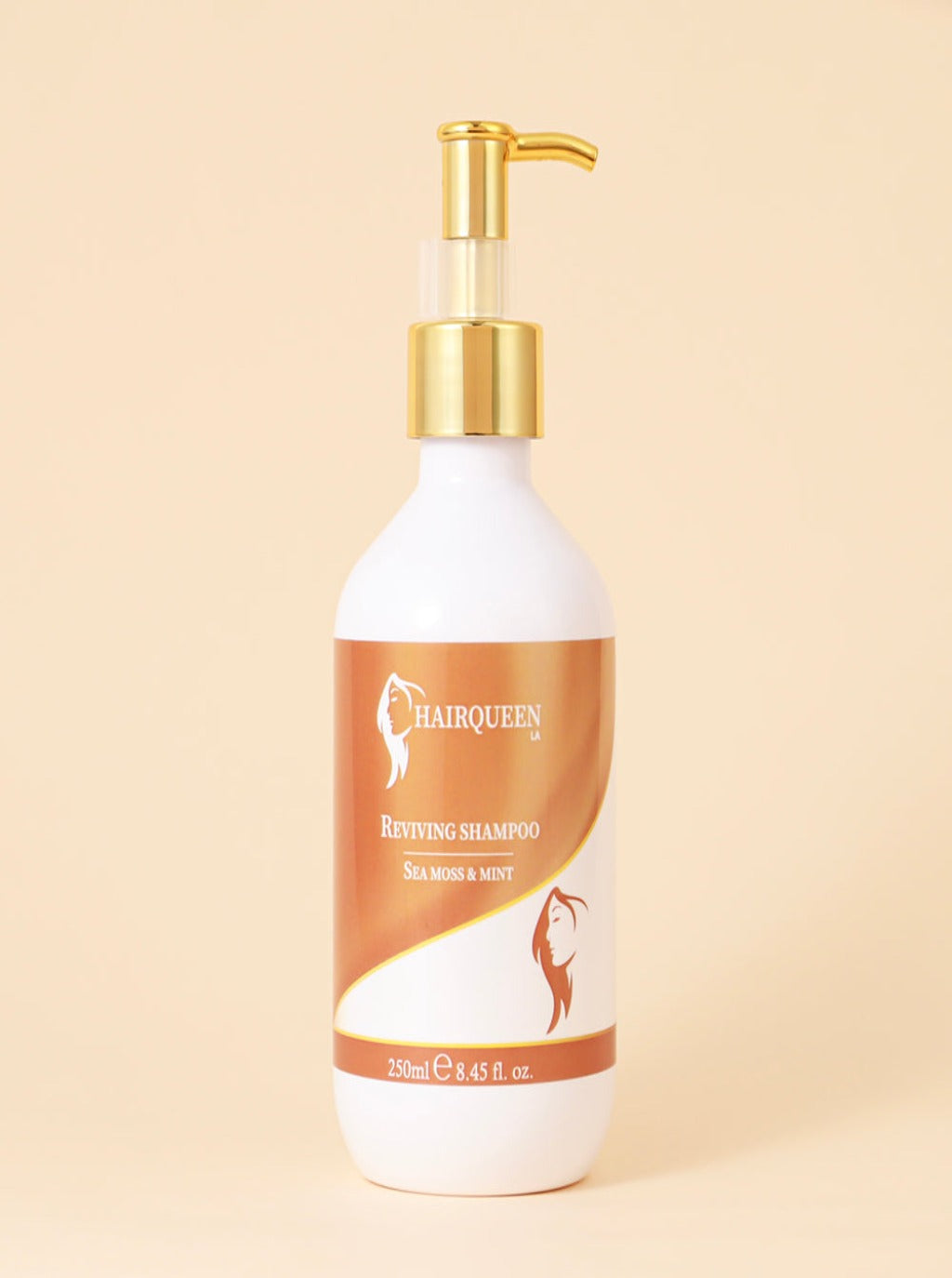 Reviving shampoo bottle with gold pump, white and amber label