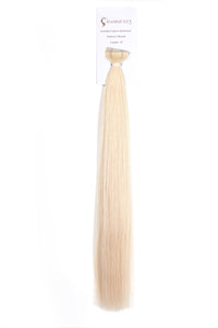 Platinum blonde tape-in hair extension strand on retail card