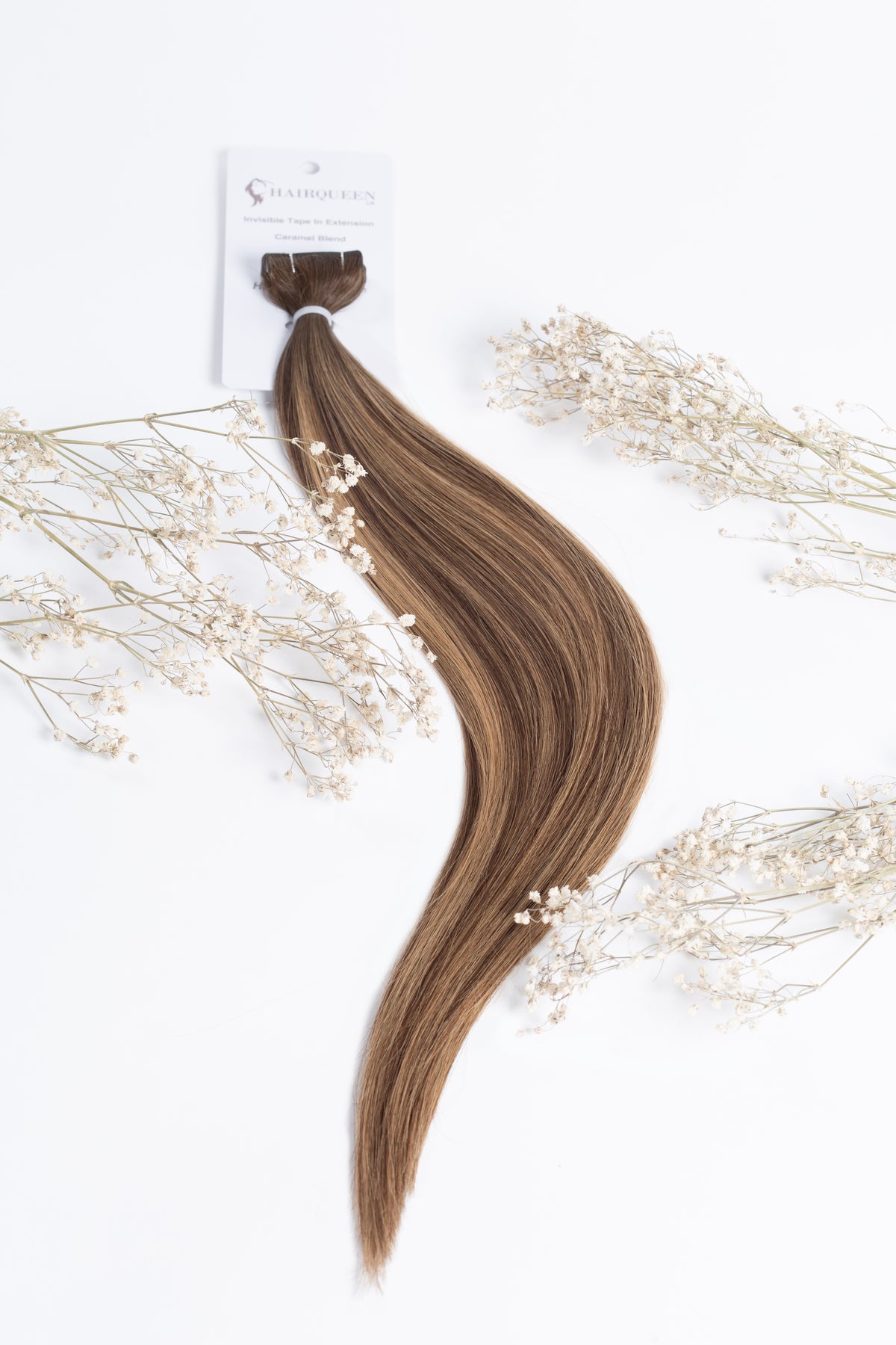 Caramel blend tape-in hair extension weft with long wavy strands