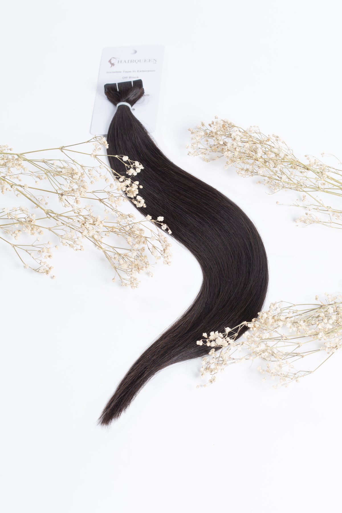 Off-black tape-in hair extensions with long straight weft and attached tape