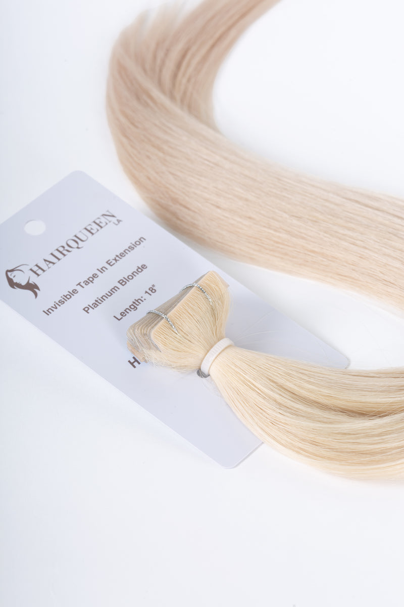 Platinum blonde invisible tape-in hair extension with attached tape tab and weft