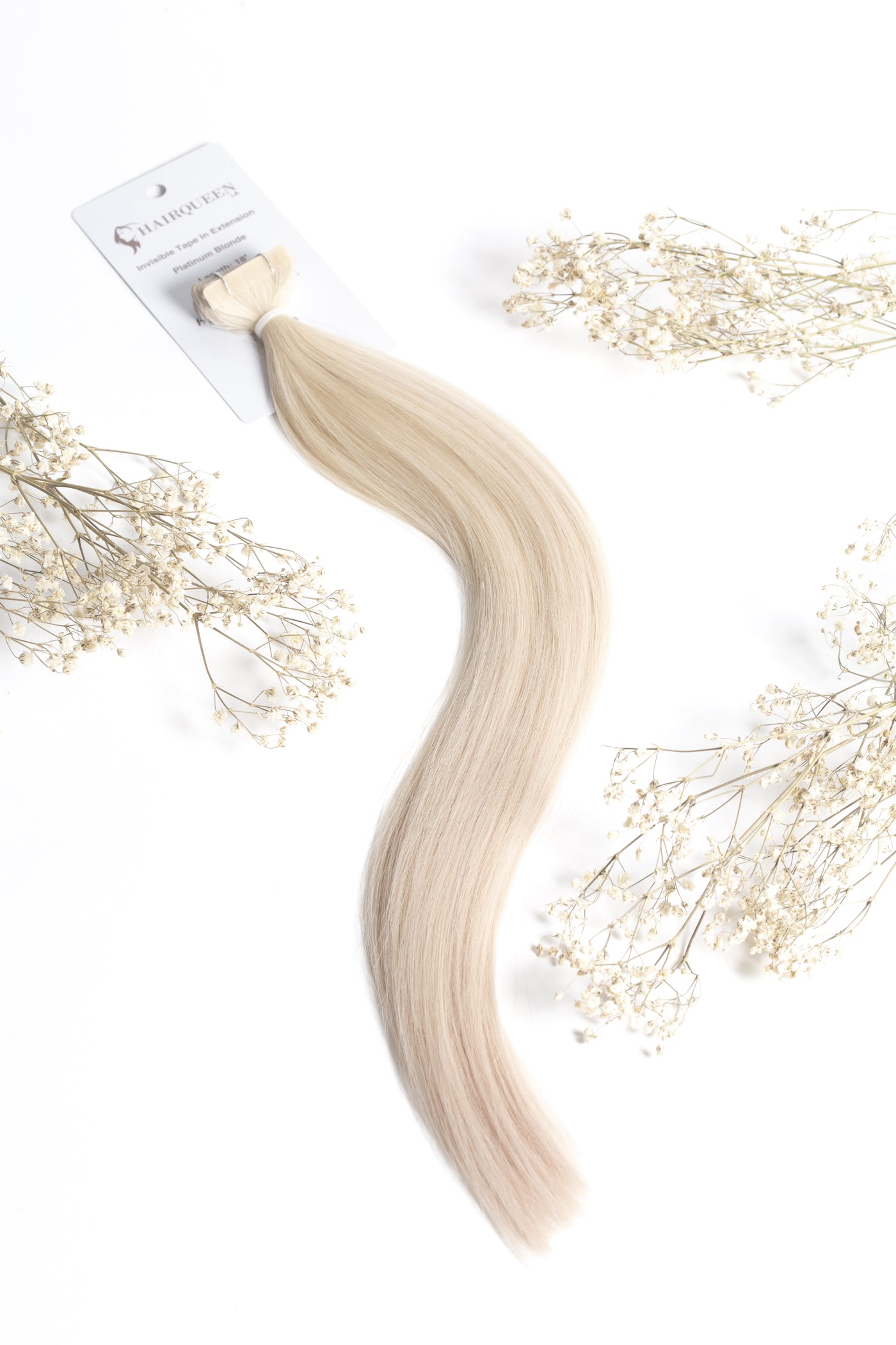 Platinum blonde hair extension strand with tape weft end