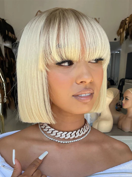 Short ash-blonde bob synthetic wig with blunt bangs and chin-length layers