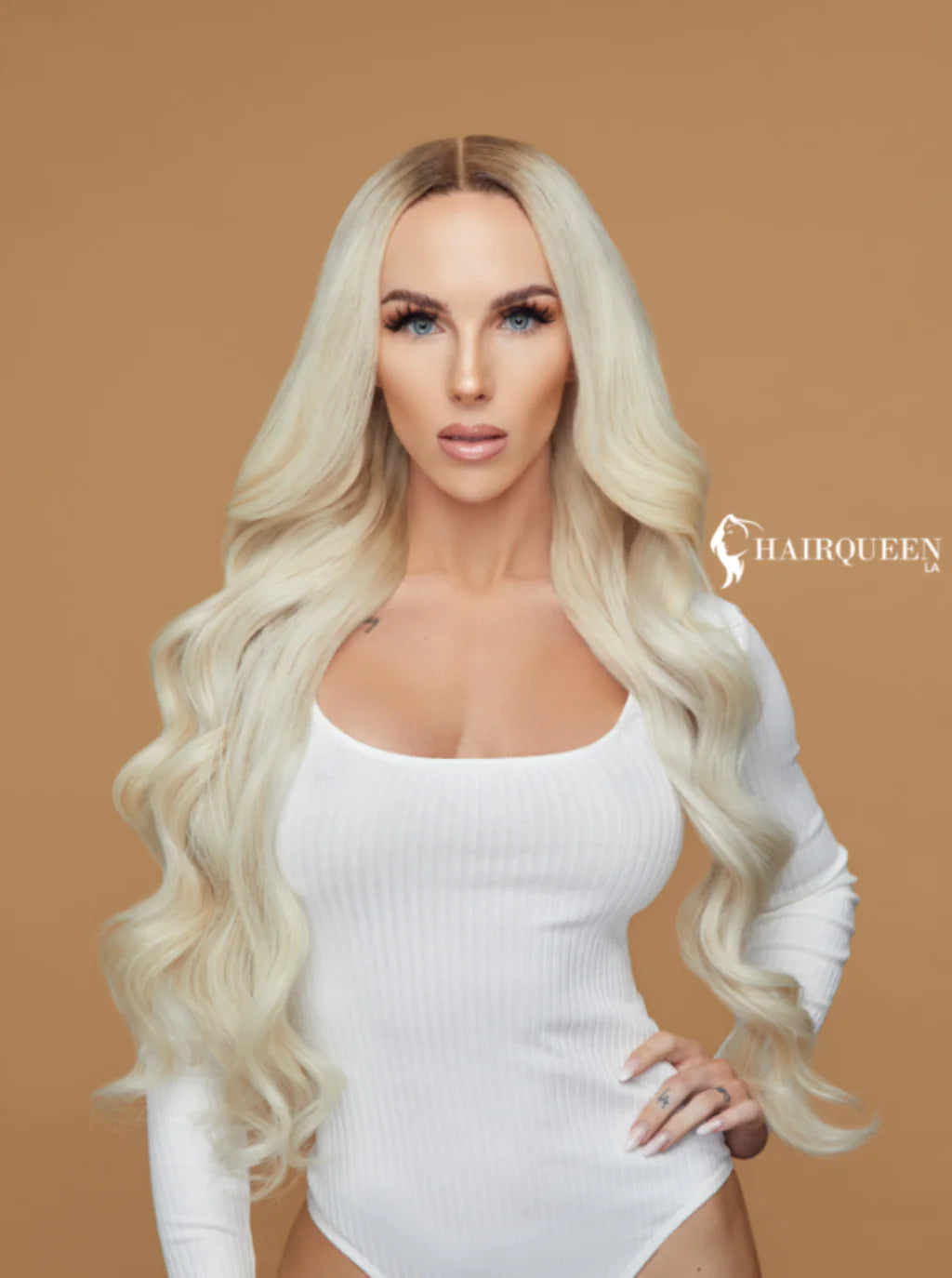 Glueless lace wig with long wavy platinum blonde hair and soft layers
