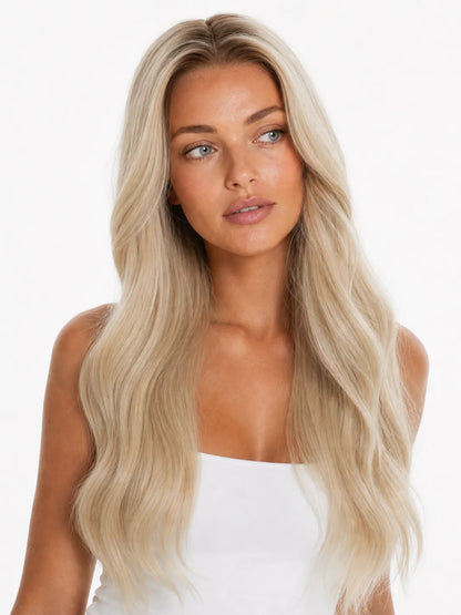 Long platinum blonde lace wig with loose, natural-looking waves