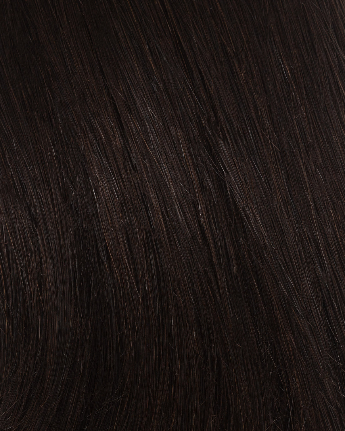 Off-black hair strand close-up with fine, smooth texture