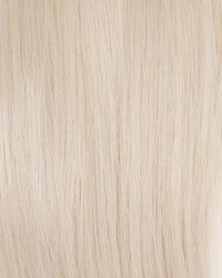 Platinum blonde K-tips hair extensions, close-up of fine straight strands