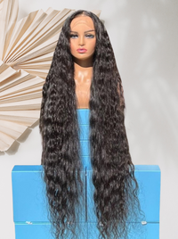 Long curly black wig with dense texture and center part