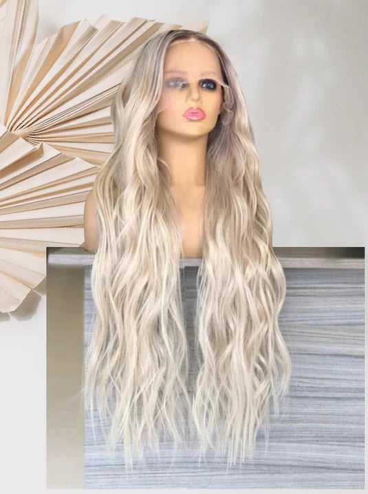 Long wavy platinum-blonde wig with center part, thick strands framing the face