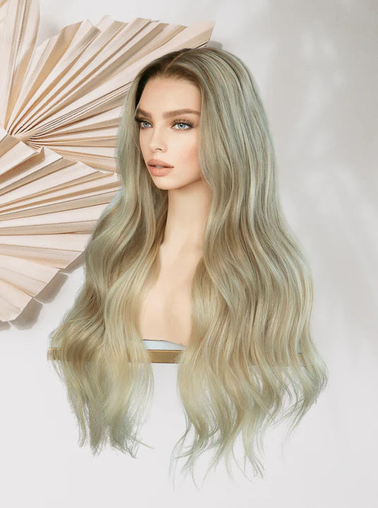 Long wavy wig in sage-ash blonde with layered, flowing waves