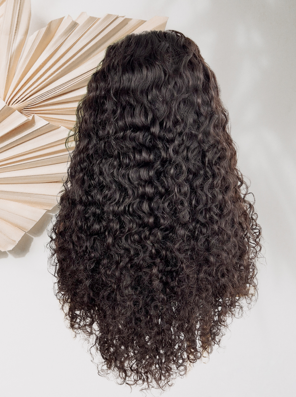 Black curly wig, back view with full long volume