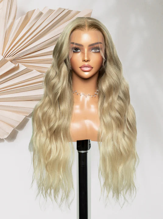 Long light-blonde synthetic wig with loose waves and side part