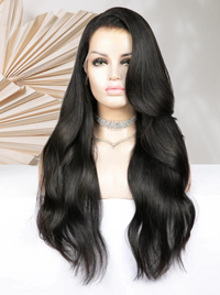 Long wavy black wig with side part and full length, loose curls