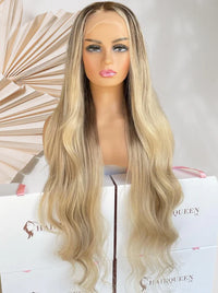 Long wavy light blonde wig with center part, voluminous hair and soft waves