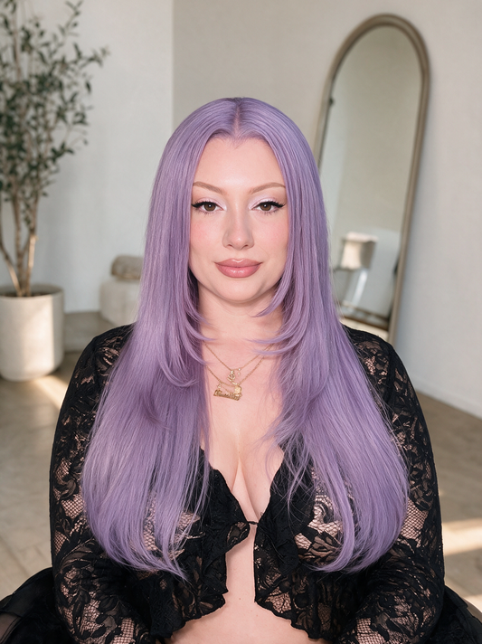 Vanilla lace-front wig with long straight lavender hair, worn by model with center part