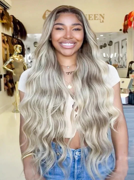 Long wavy wig with light ash-blonde roots and flowing layered waves