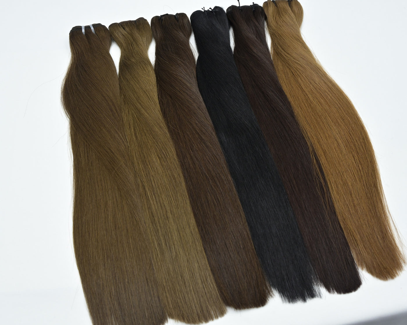 Straight hair weft bundle with mixed dark and light brown strands