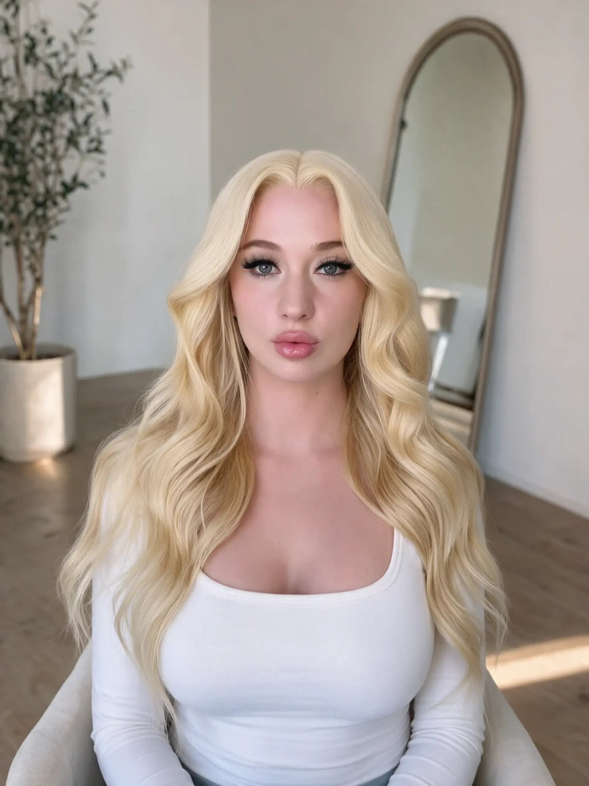 Long blonde wavy wig with soft waves framing the face