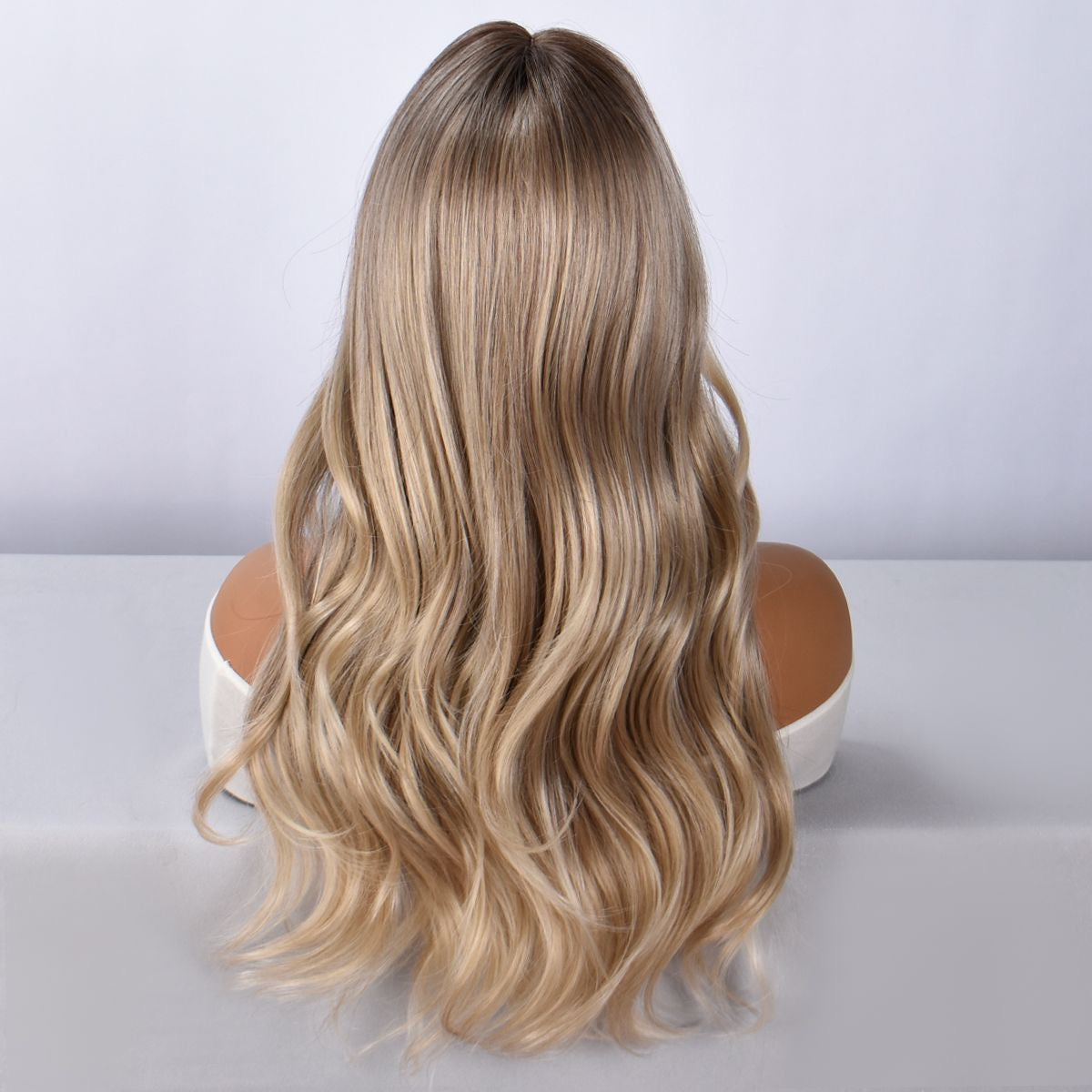 Long blonde ombre wavy synthetic wig with bangs, back view