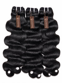 Brazilian body wave human hair bundles, dark black loose waves, three wefts.