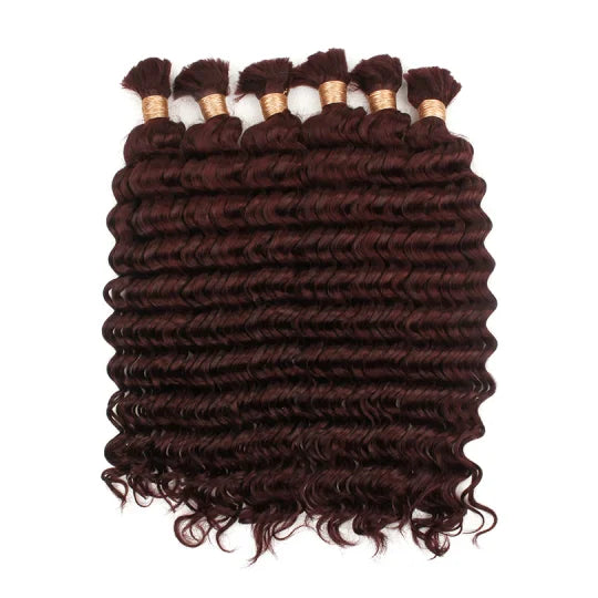 Curly hair bundle in deep burgundy with visible wefts and short loose curls
