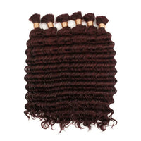 Curly hair bundle in deep burgundy with visible wefts and short loose curls
