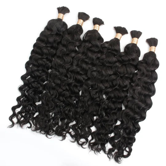 Latin wave bulk hair, dark black loose curls in multiple bundles with gold tips.