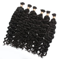 Black curly bulk hair bundles with gold thread wraps and loose ringlet texture