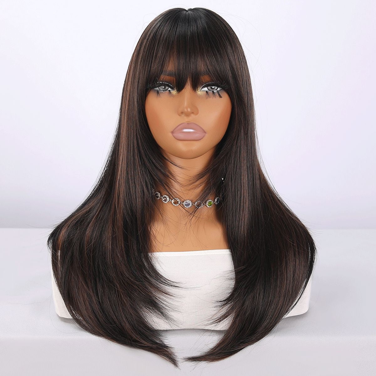 Long black synthetic wig with long layers, side bangs, and brown highlights
