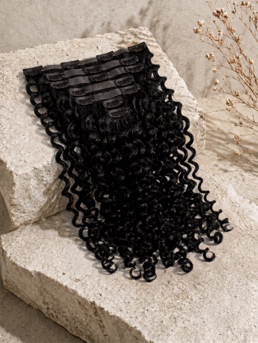 Seamless clip-in hair extensions weft with tight curly black hair and comb clips