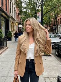 Ash gray clip-in extensions, long wavy hair worn with center-part hairstyle