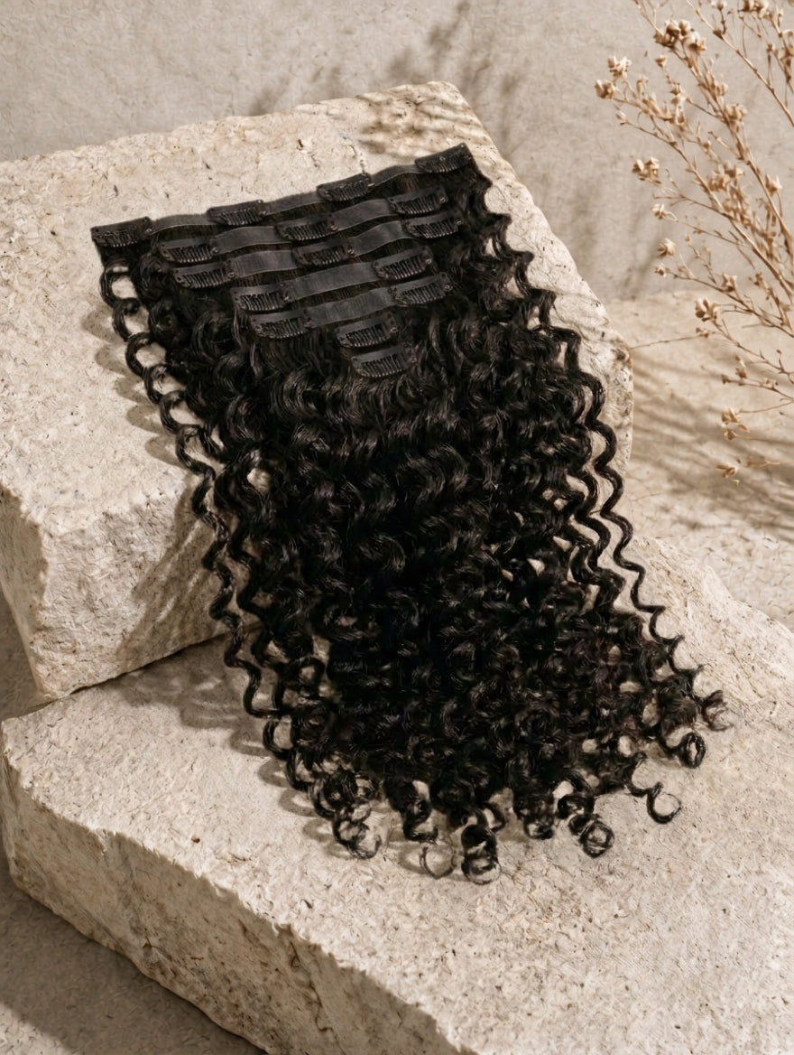 Seamless clip-in hair extensions bundle with curly black hair and comb clips