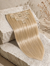 Seamless clip-in extensions bundle in light blonde straight hair with small weft clips